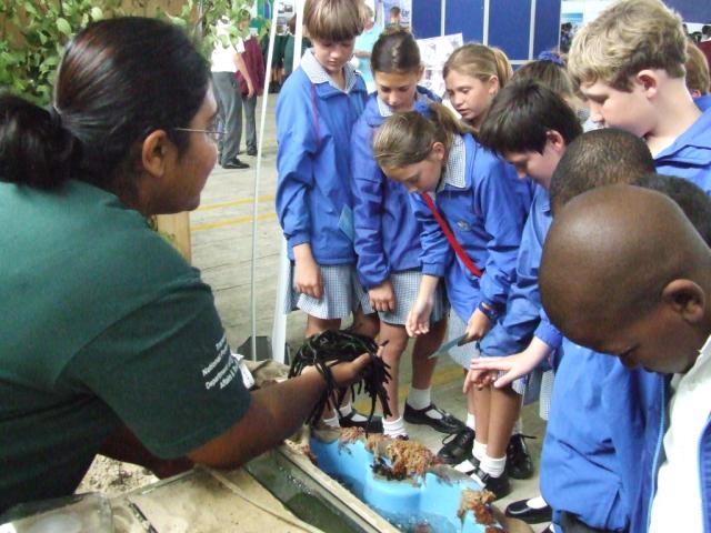 PhD student in the Botany Department, Anusha Rajkaran, showing students marine algae